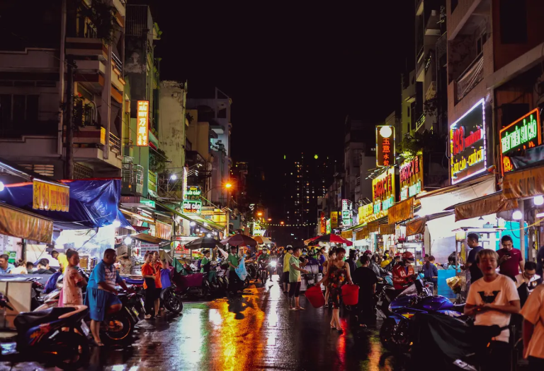 crowded night market showing why AI itineraries fail in real travel conditions