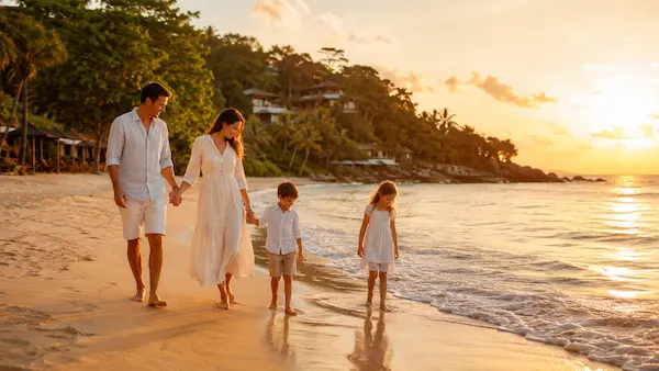 Family enjoying a sunset walk along a Phuket beach during a 7-Day Family Phuket Holiday with children exploring the shoreline
