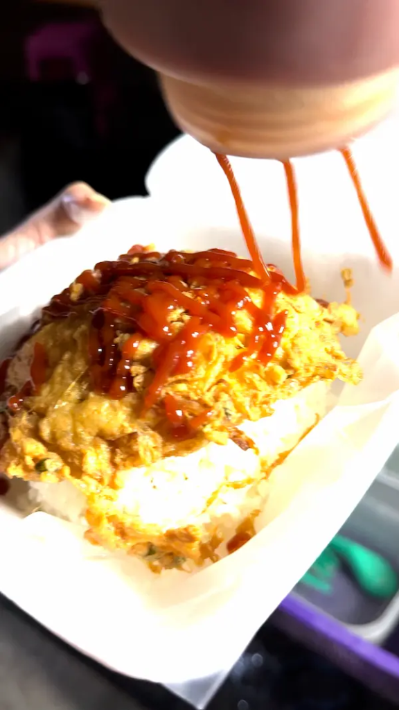 Finished Kai Jeow Thai omelette served with rice at a Phuket street food stall