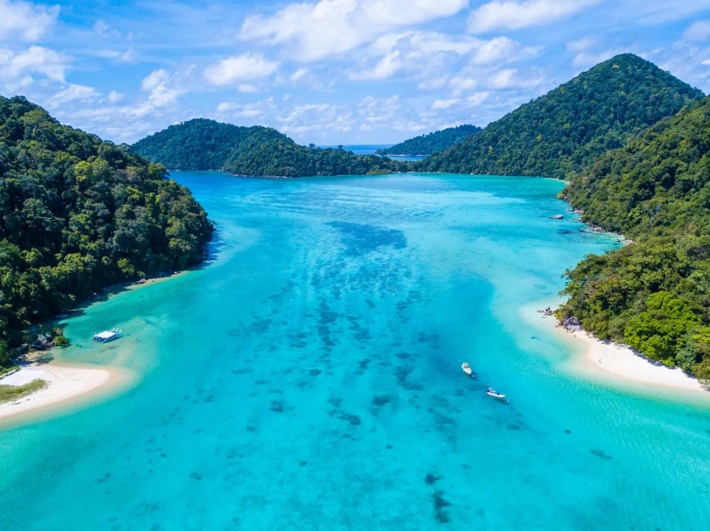 Aerial view of the Surin Islands showing turquoise water, coral reefs and jungle-covered islands near Phuket, Thailand
